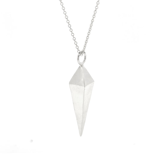 A silver geometric diamond shaped pendant on a silver chain.