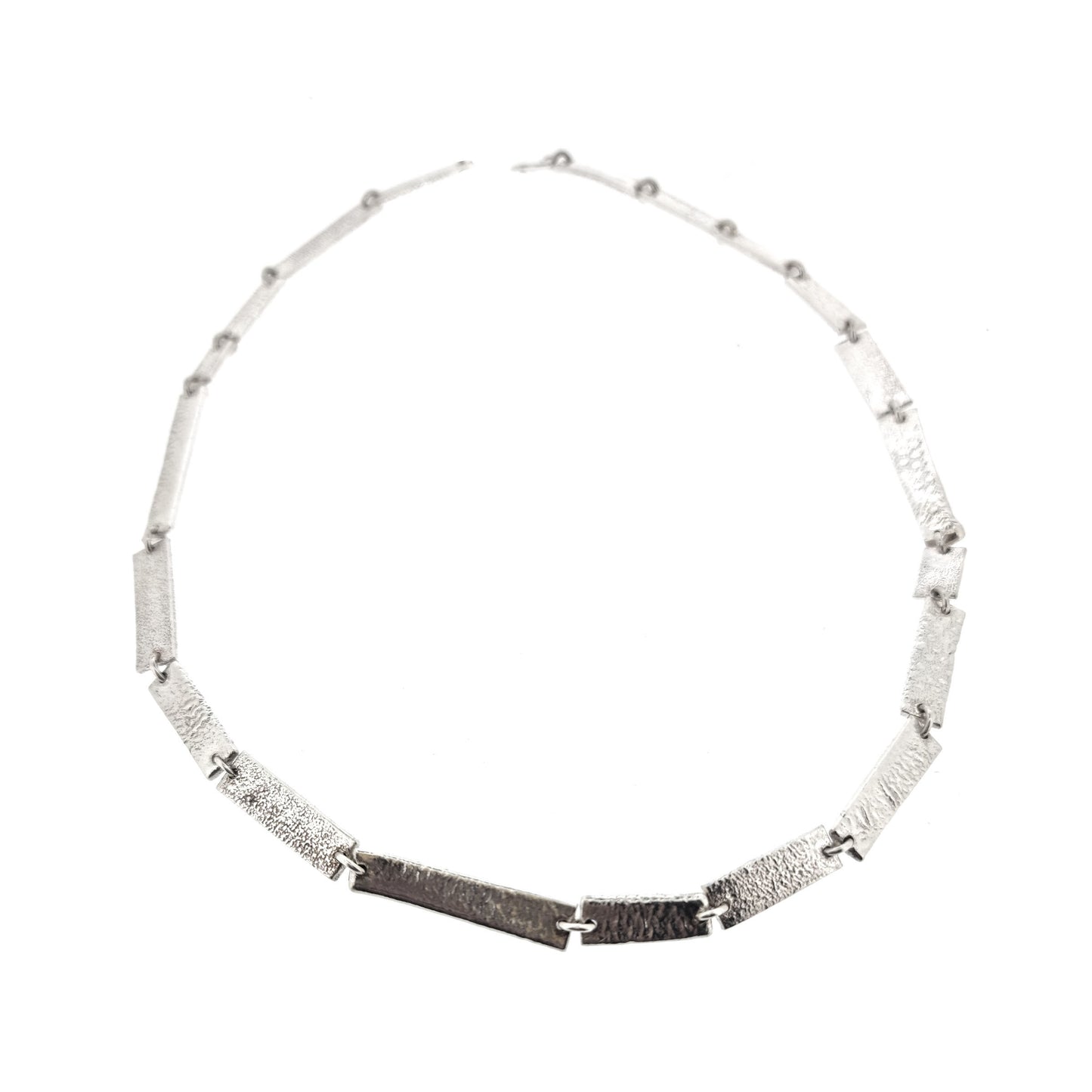 Silver necklace with textured rectangular links of different sizes.