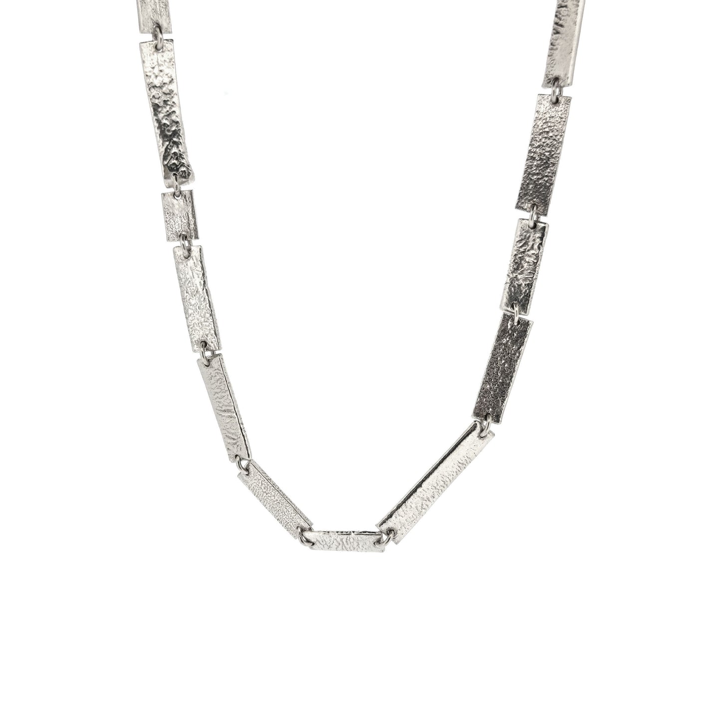 Silver necklace with textured rectangular links of different sizes.