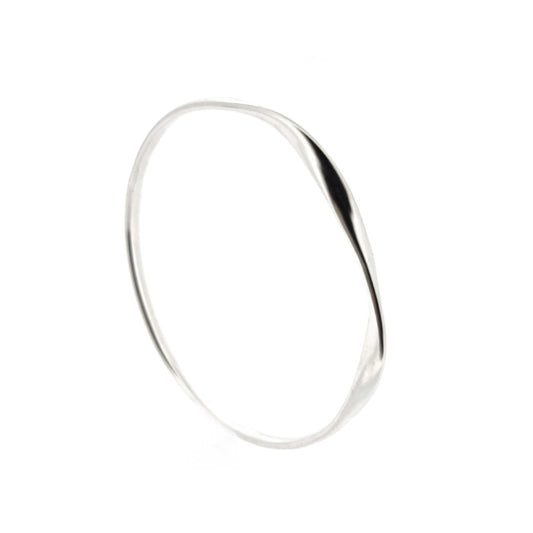 Round silver bangle with oval profile and a twist in one part.