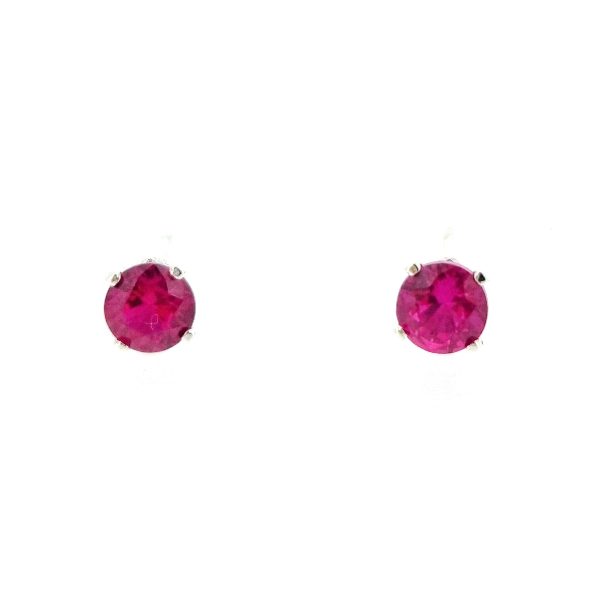 Silver 4 claw stud earrings with a round pinky red ruby gemstone in each. 4mm.