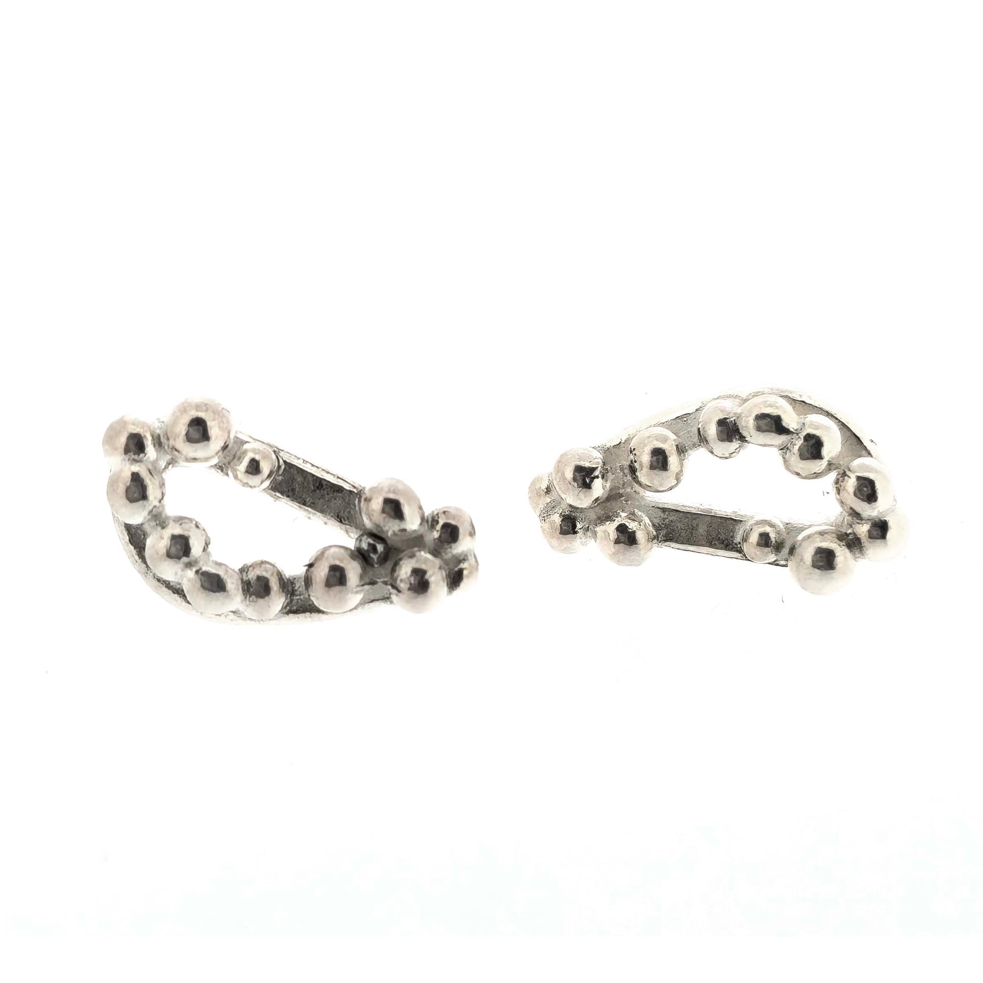Silver asymmetric stud earrings with an open soft triangle shape and silver balls.