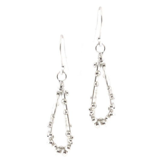 Silver drop earrings in a asymmetrical open teardrop shape with silver balls. S.own on a white background.