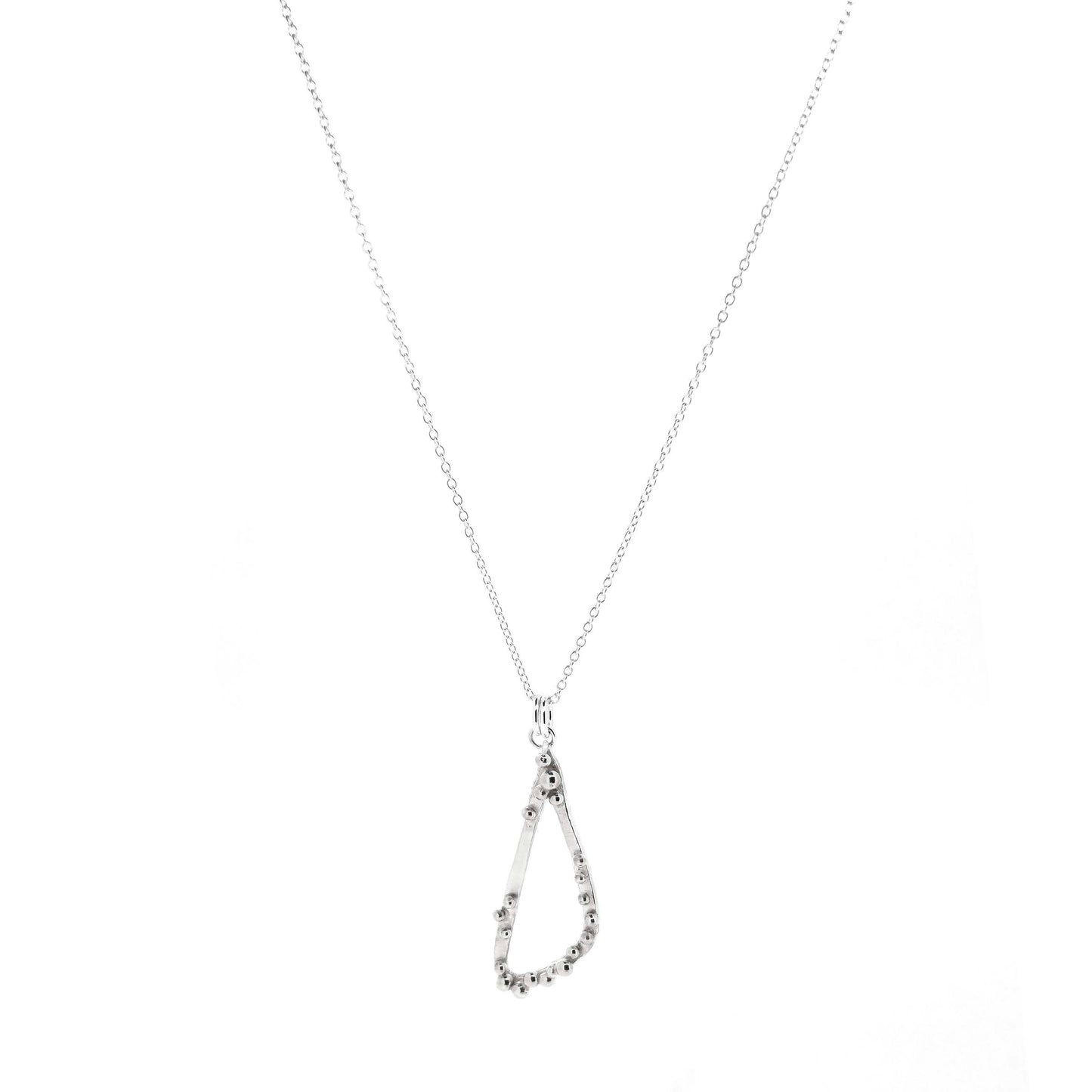 A silver asymmetrical pendant with a soft open triangle shape and silver balls, suspended from a silver chain. Shown on a white background. 