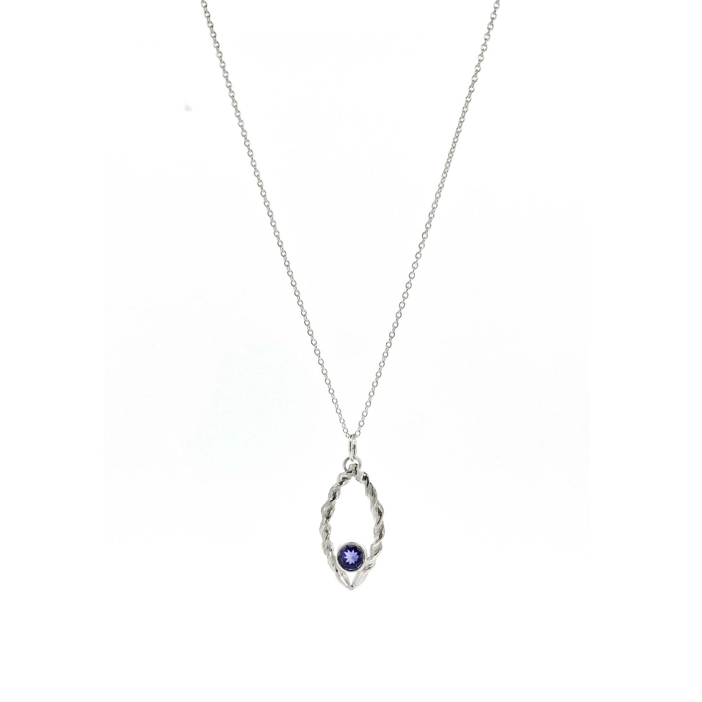 Silver pendant featuring 2 twists of silver making an open boat shape with a purple blue iolite gemstone set in the bottom point. On a silver chain.