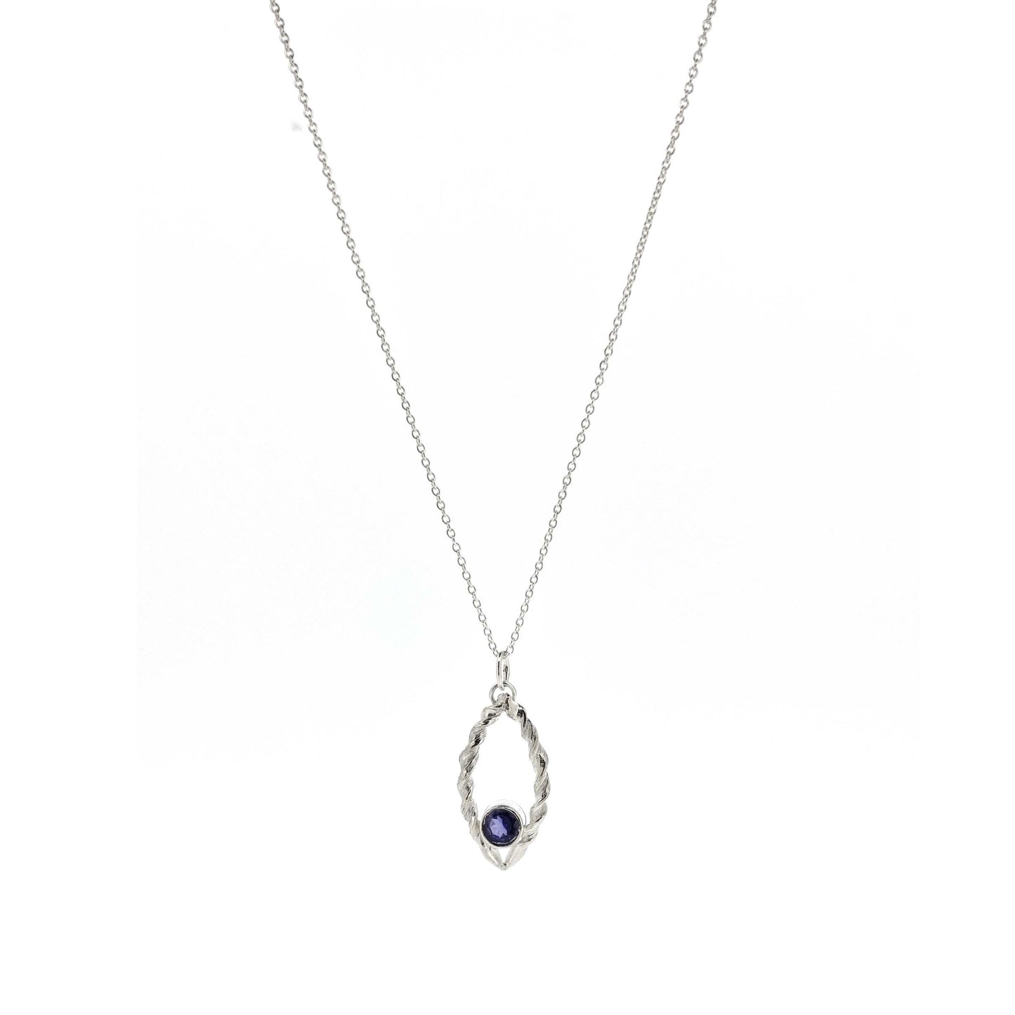 Silver pendant featuring 2 twists of silver making an open boat shape with a purple blue iolite gemstone set in the bottom point. On a silver chain.