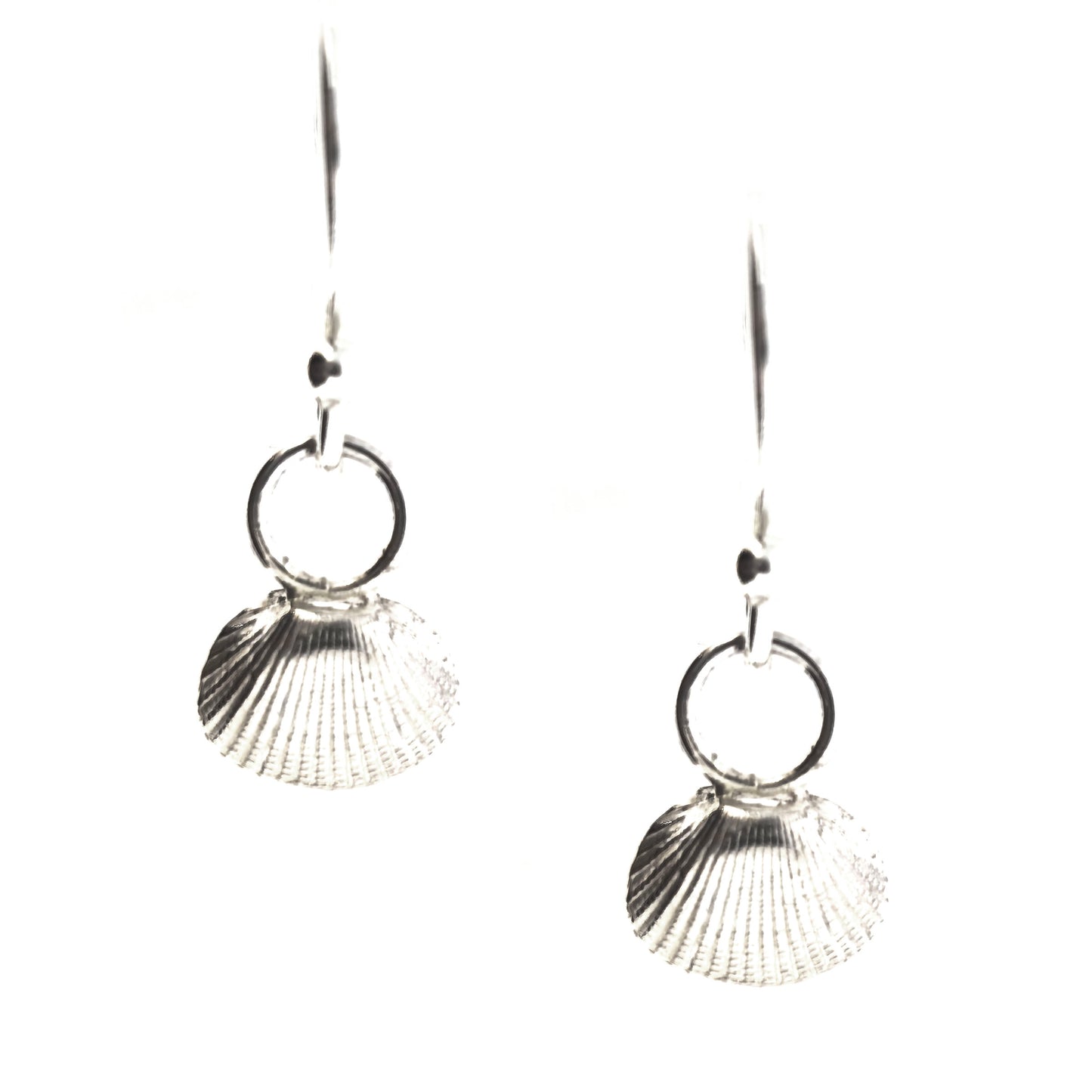Silver cockle shell drop earrings on white background. Handmade. Mijoux Jewellery.