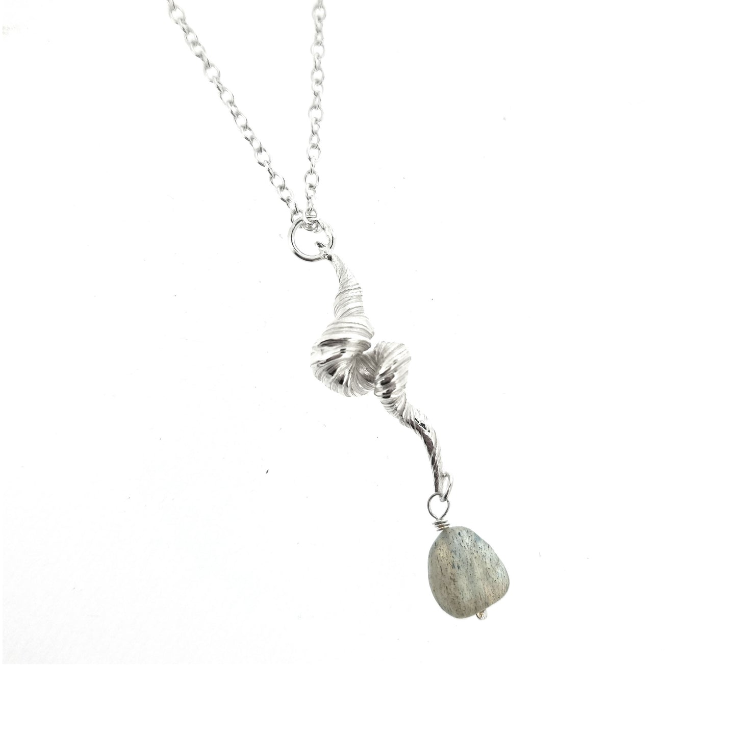 Silver twisted pendant with striations and a labradorite gemstone bead, on a silver chain.