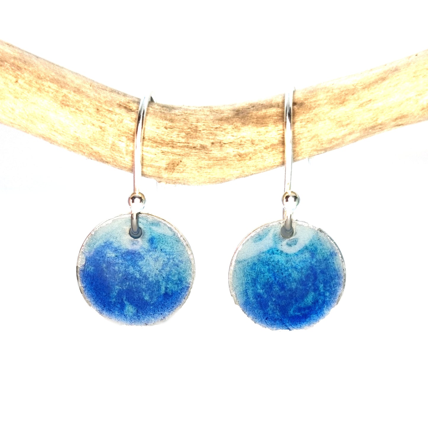 Silver round drop earrings with a mix of dark and light blue enamel.