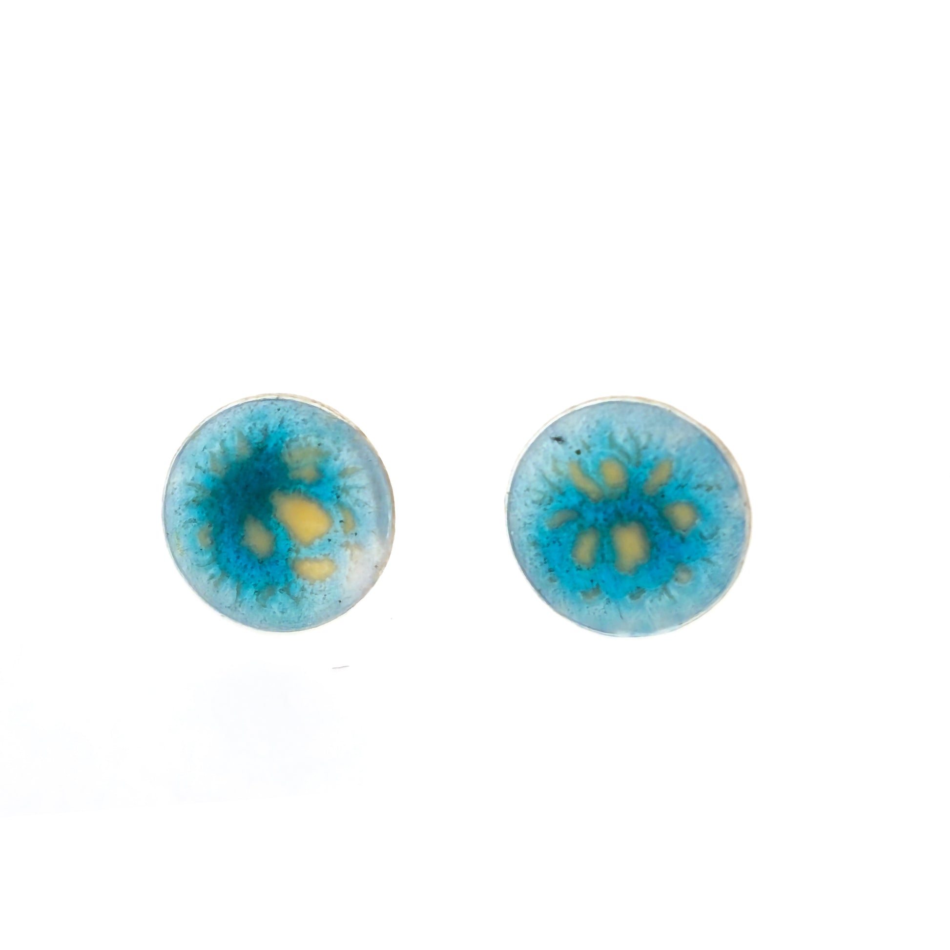 Round silver stud earrings with a turquoise and clear speckled enamel.