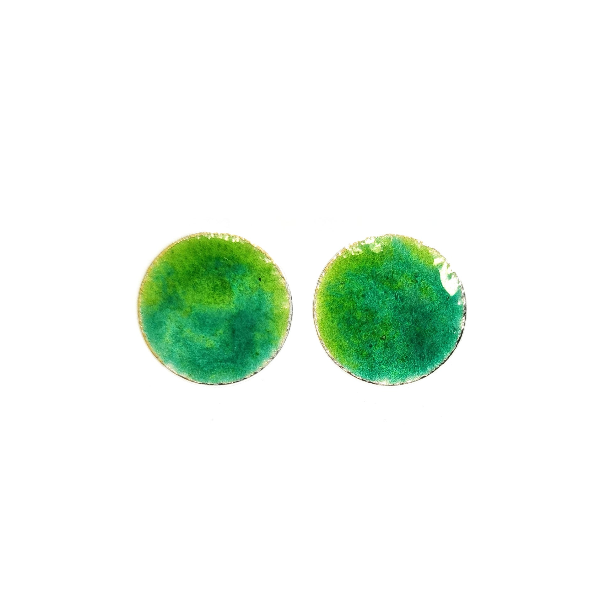 Round silver stud earrings with a mix of green enamels.