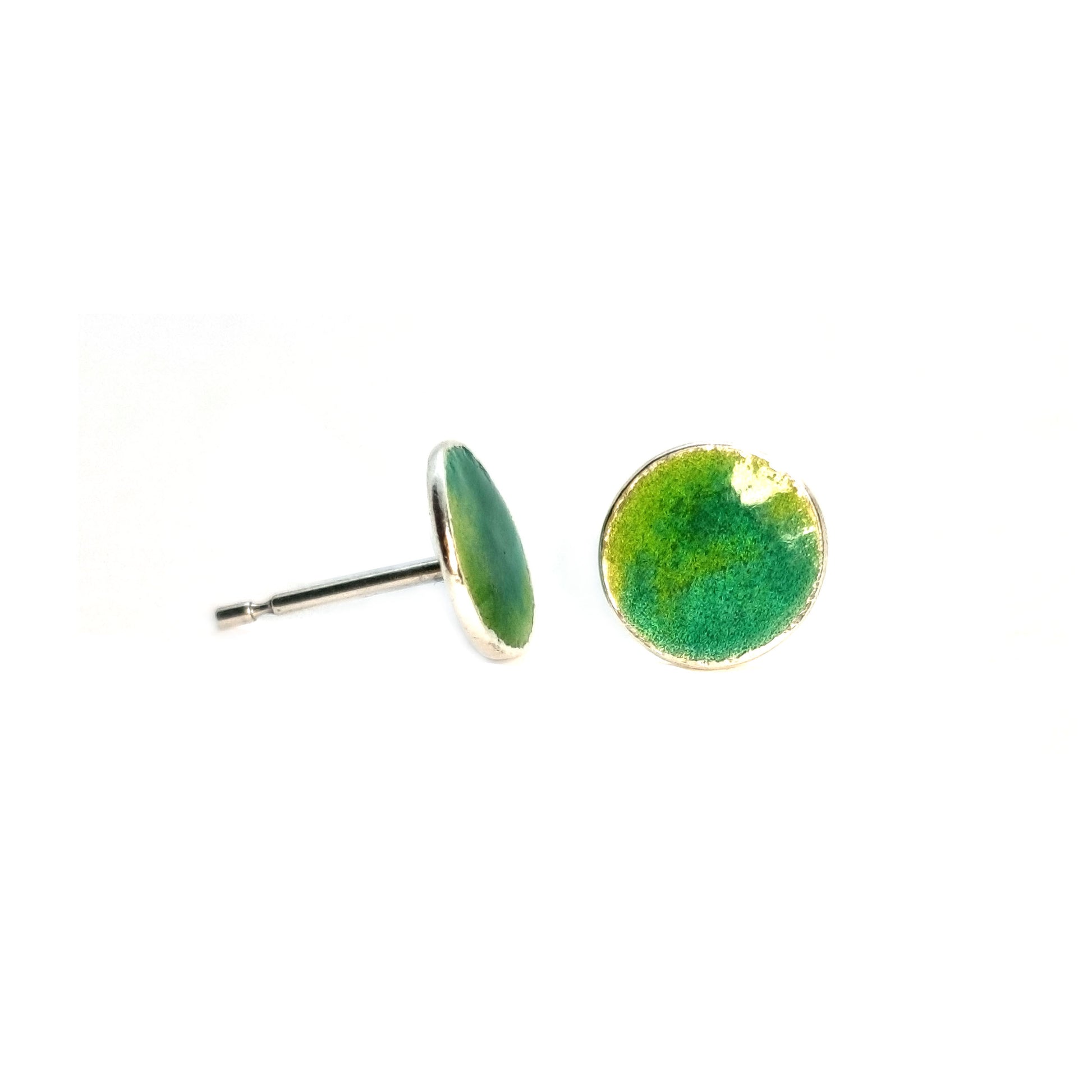 Round silver stud earrings with a mix of green enamels.