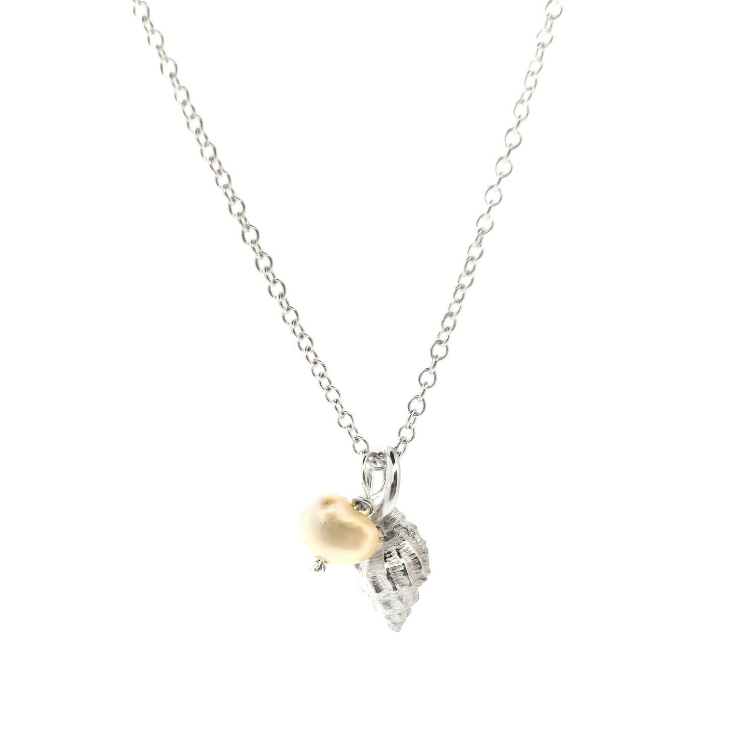 A silver periwinkle shell pendant with a cream coloured pearl suspended from a silver chain. On a white background. Handmade. Mijoux Jewellery.