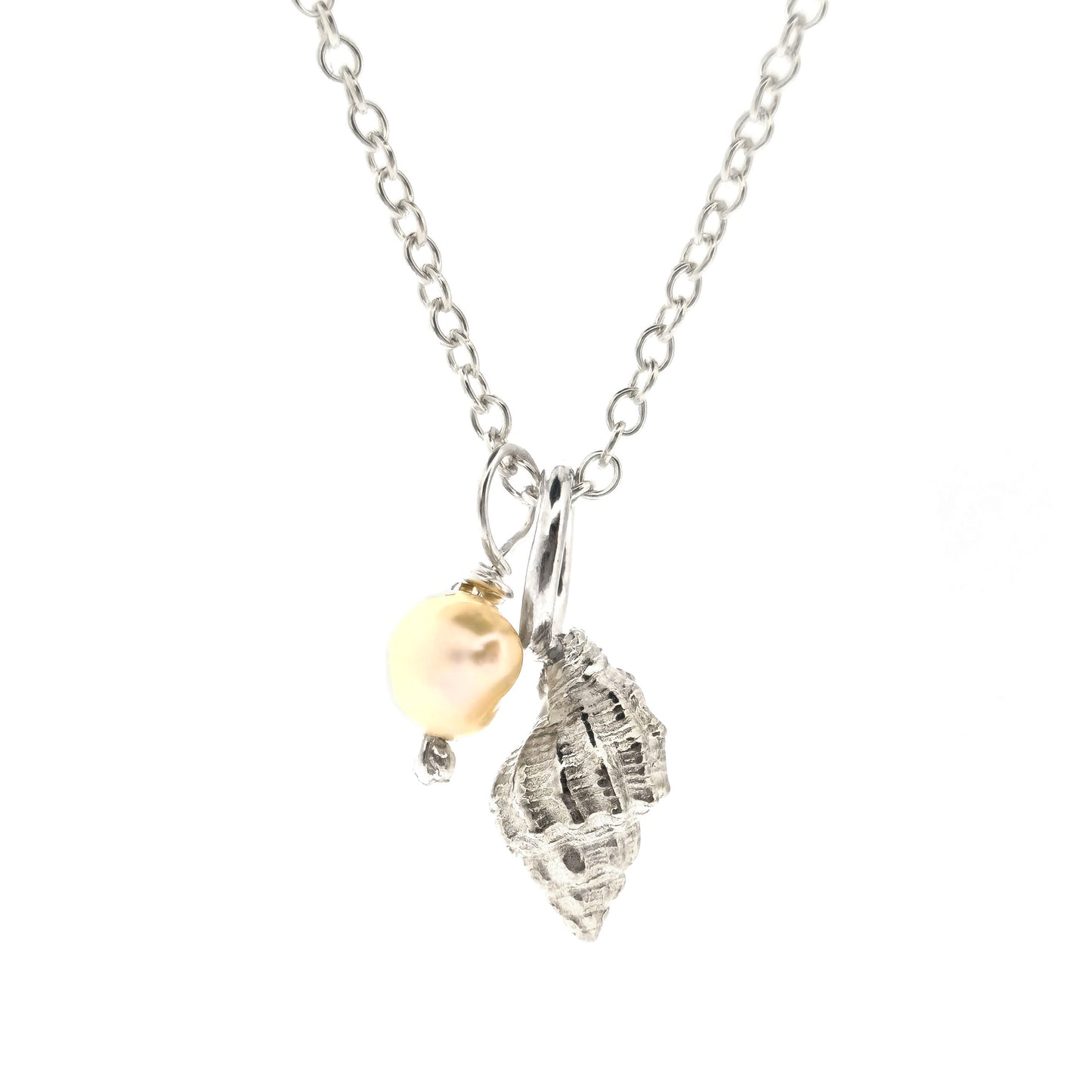 A silver periwinkle shell pendant with a cream coloured pearl suspended from a silver chain. On a white background. Handmade. Mijoux Jewellery.