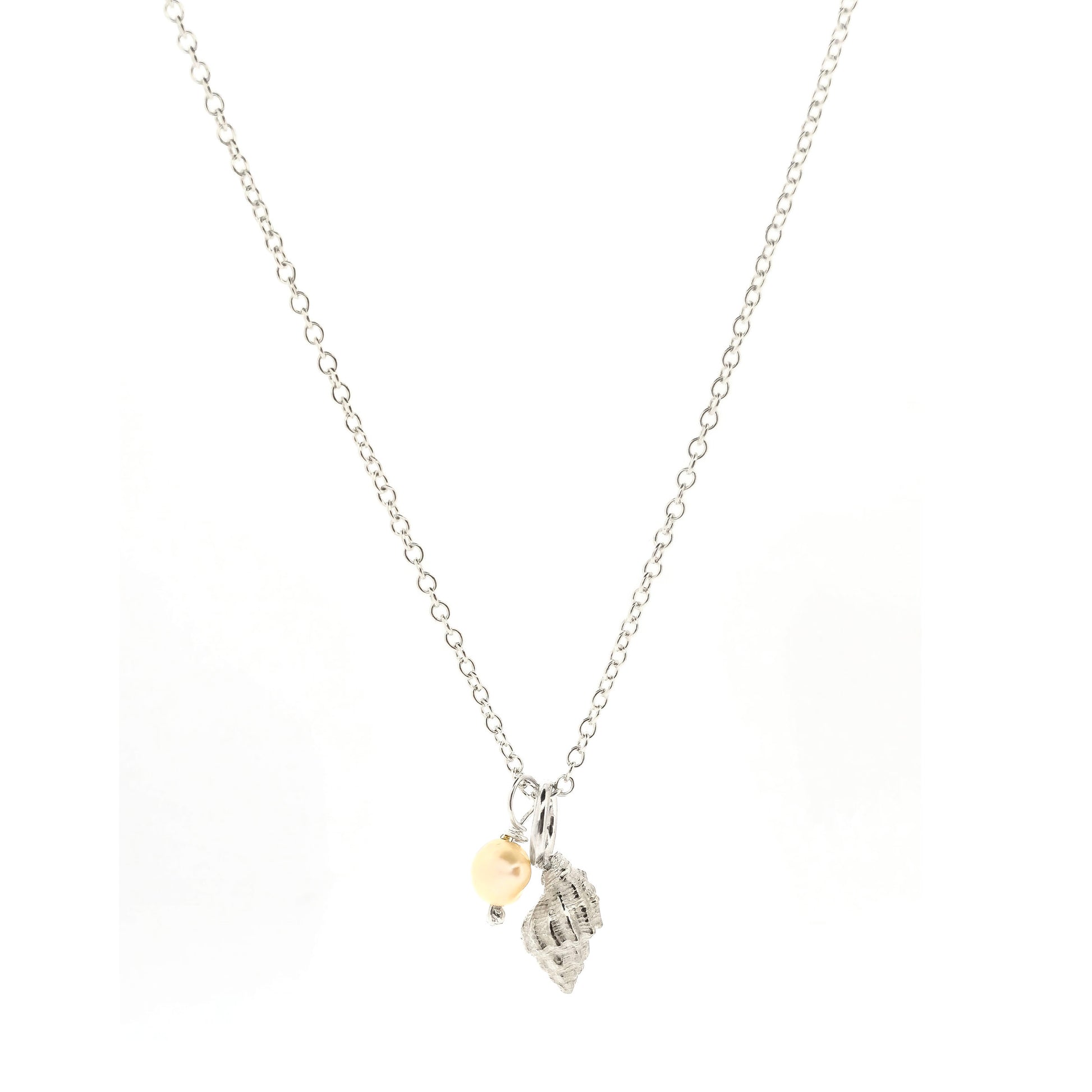 A silver periwinkle shell pendant with a cream coloured pearl suspended from a silver chain. On a white background. Handmade. Mijoux Jewellery.