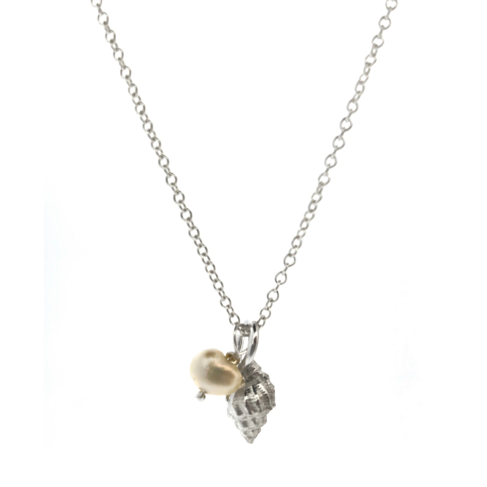 A silver periwinkle shell pendant with a cream coloured pearl suspended from a silver chain. On a white background. Handmade. Mijoux Jewellery.