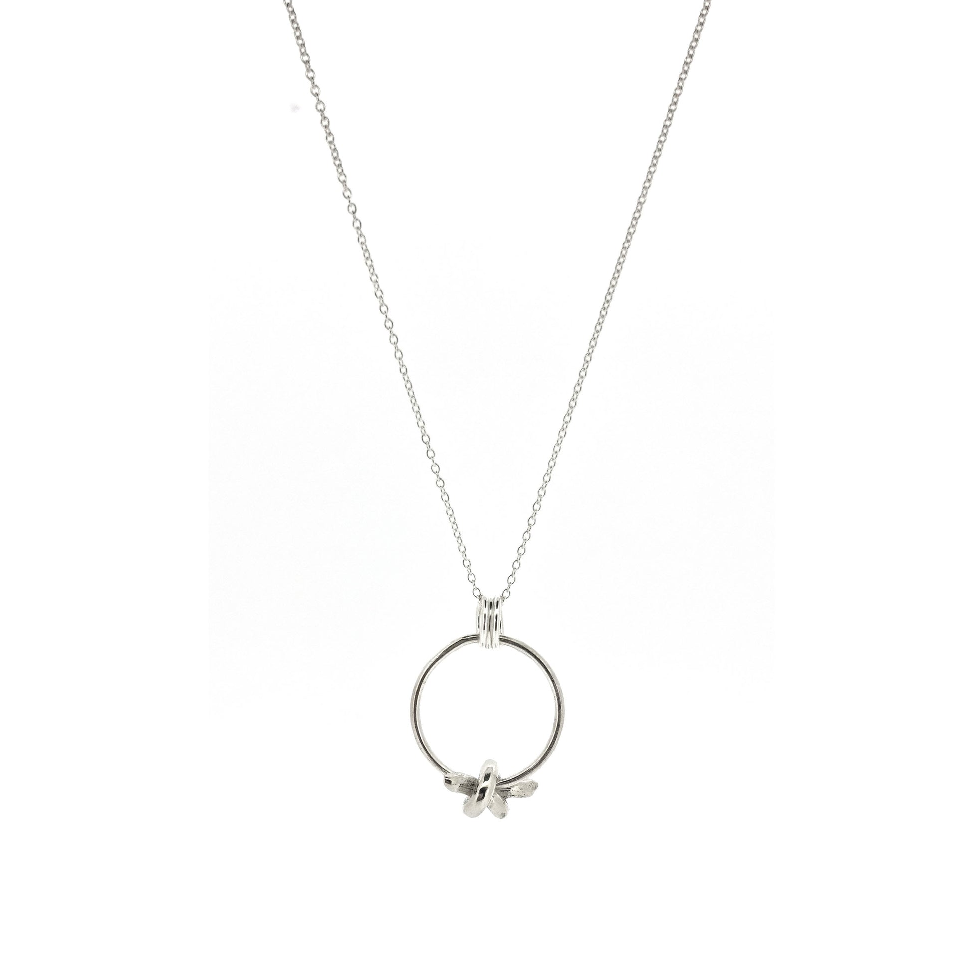 Silver circle pendant with spinning knot charm and triple circle bail. Suspended on a silver chain.