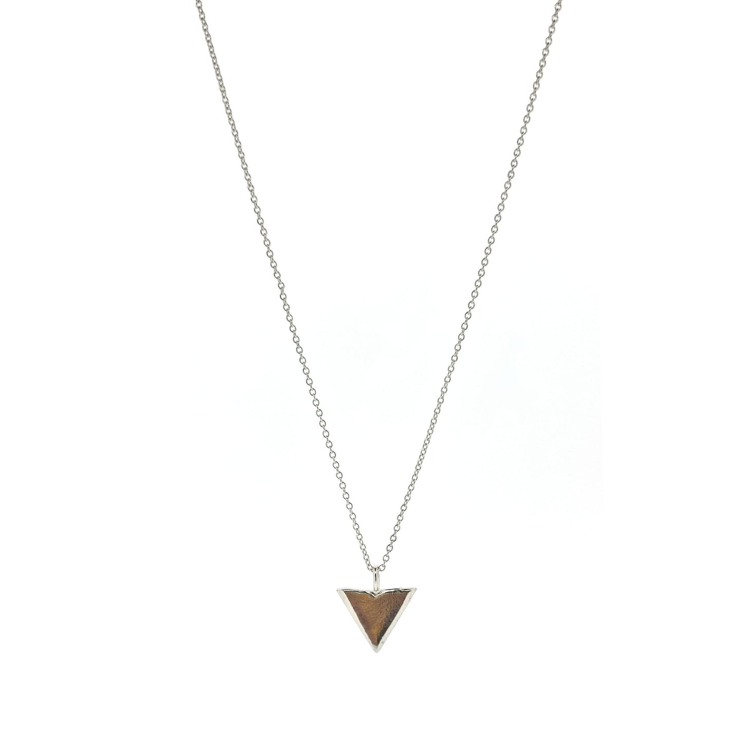 A silver beveled triangle shaped pendant on a silver chain