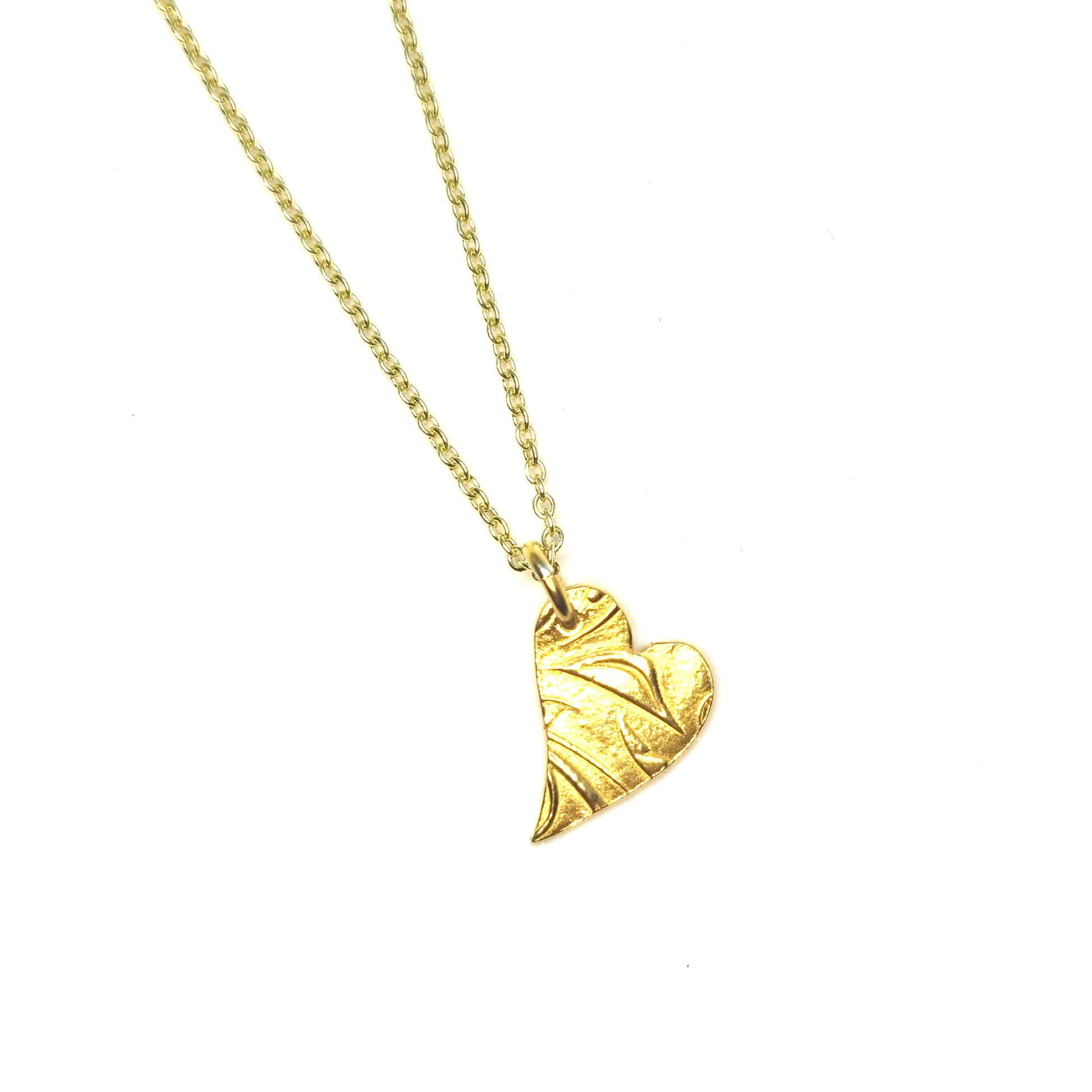 Yellow gold vermeil asymmetrical heart pendant with a leaf & vine design on a yellow gold vermeil chain.