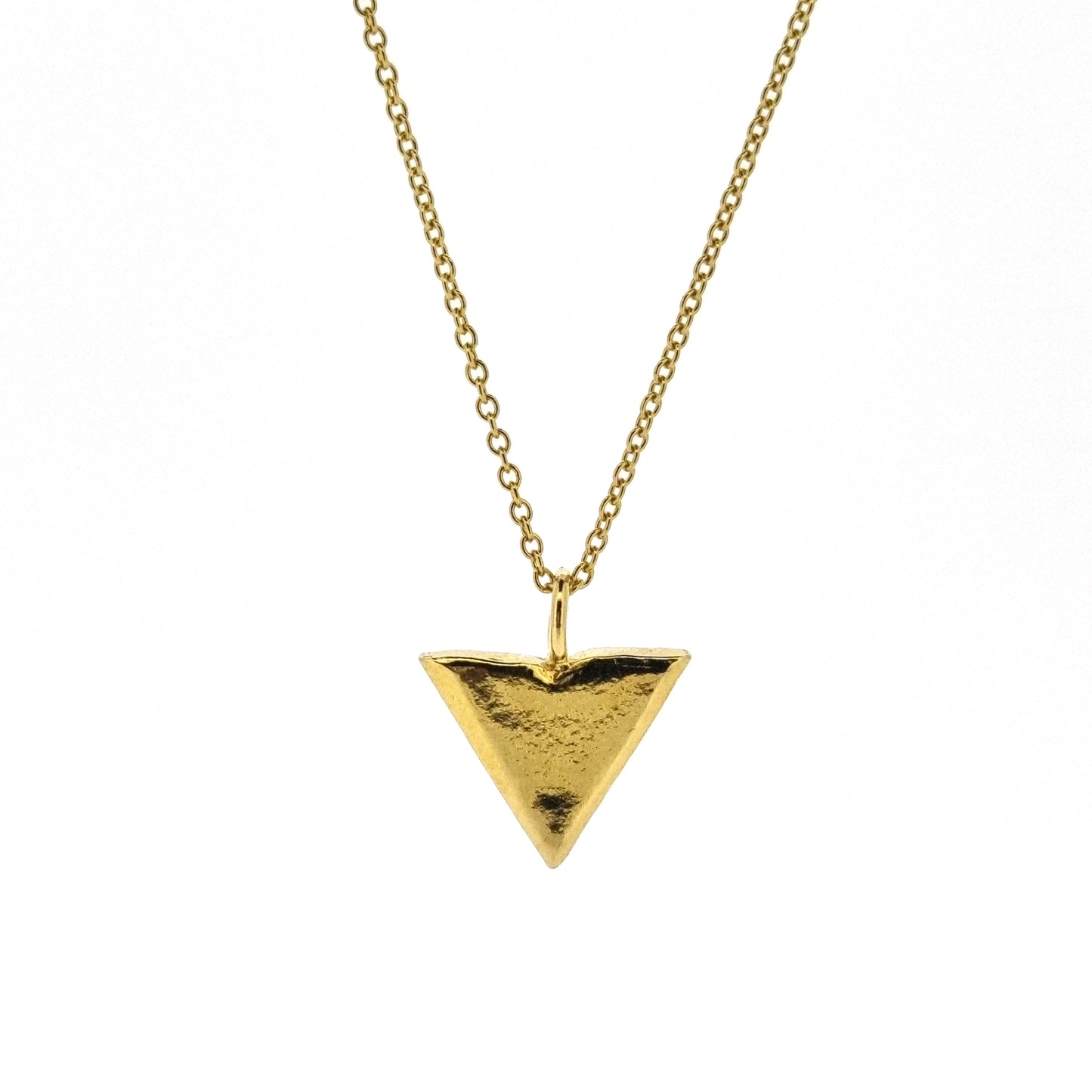 A yellow gold vermeil triangle pendant on a yellow gold vermeil chain.