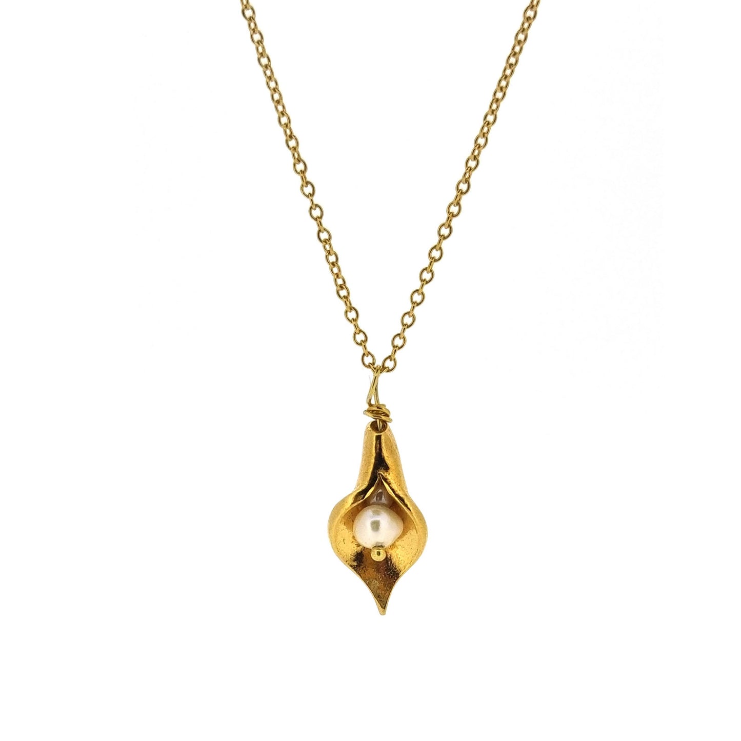 A yellow gold vermeil calla lily pendant with a freshwater white pearl on a yellow gold vermeil chain.