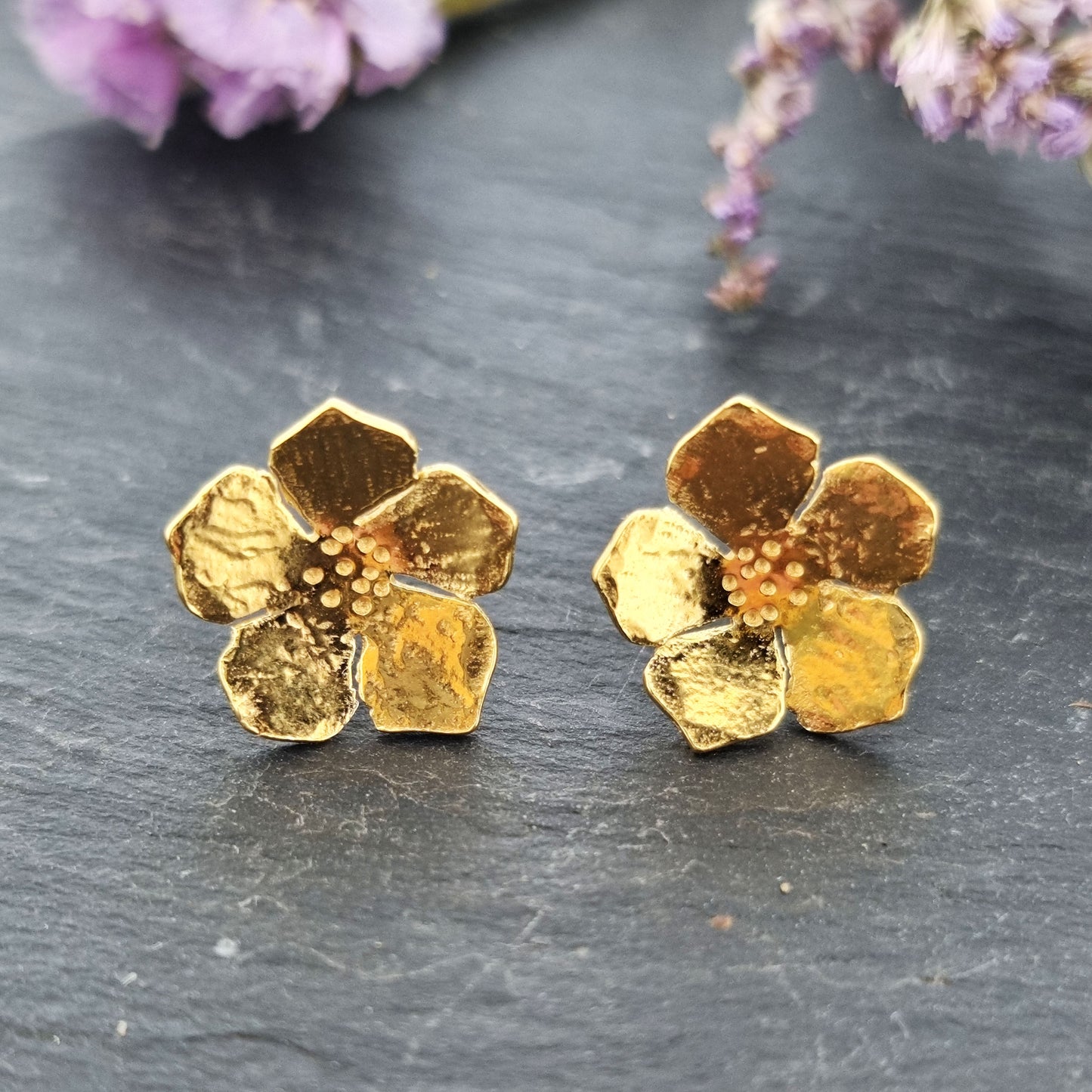 Yellow gold vermeil 5 petal flower stud earrings. Pictured with purple flowers.