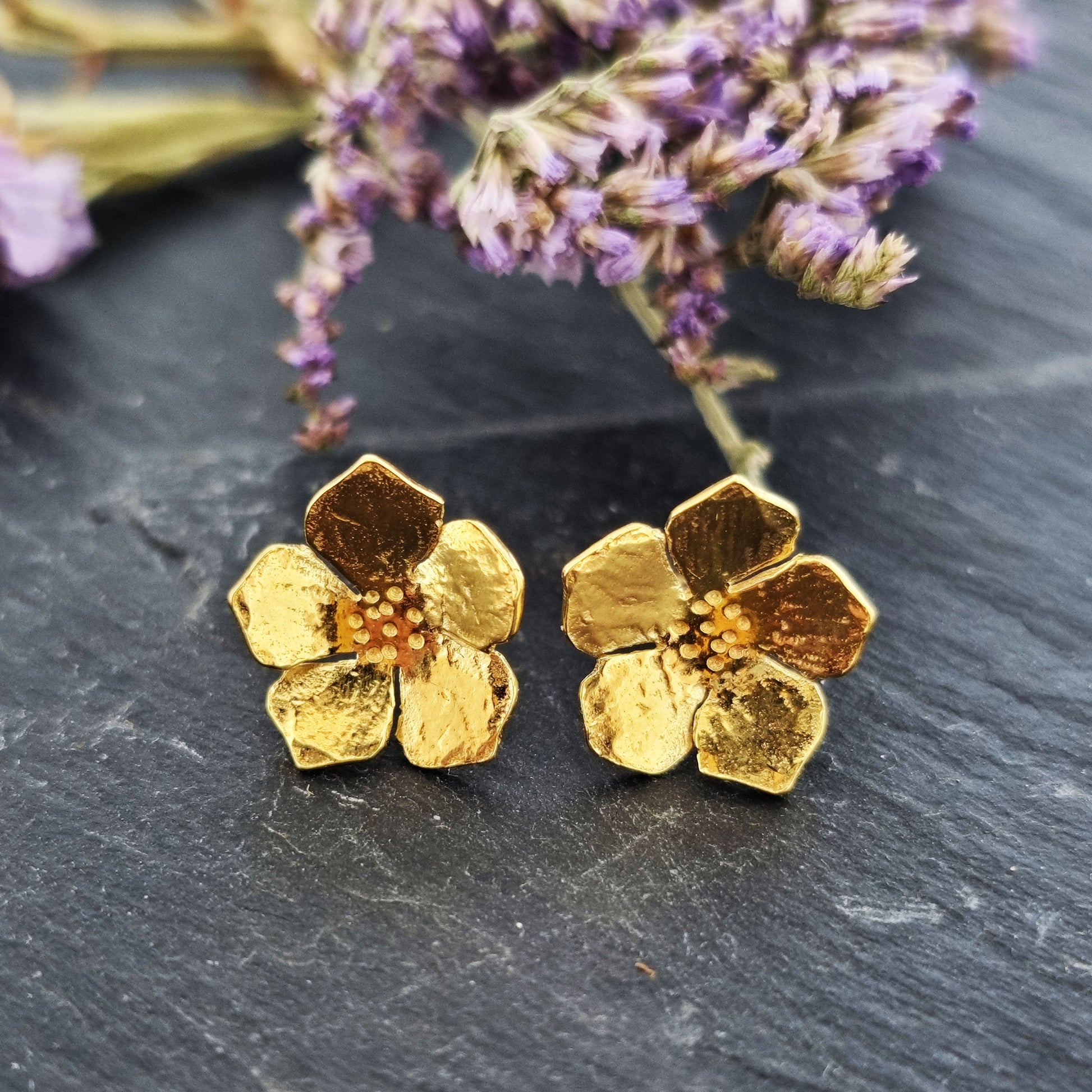 Yellow gold vermeil 5 petal flower stud earrings. Pictured with purple flowers.