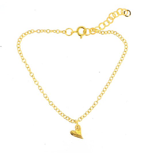 Gold bracelet with a textured asymmetric heart-shaped charm on a white background