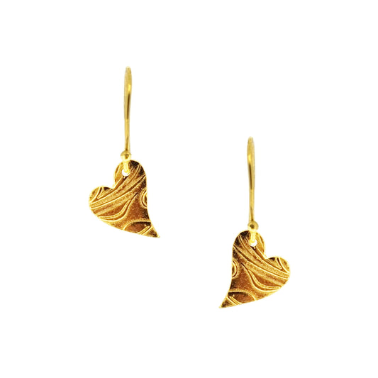Yellow gold vermeil drop earrings featuring an asymmetrical heart with a leaf vine pattern suspended from an ear wire.
