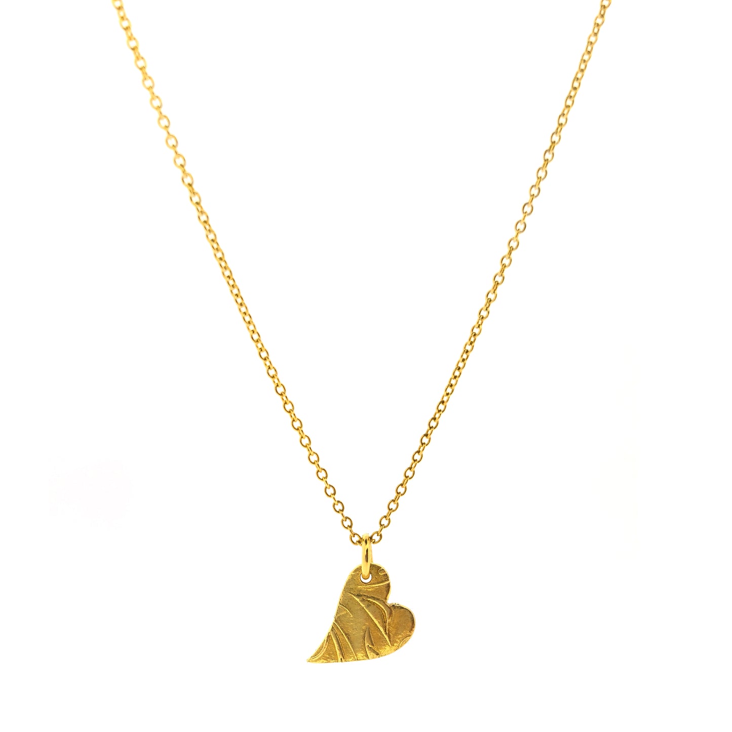 Yellow gold vermeil asymmetrical heart pendant with a leaf & vine design on a yellow gold vermeil chain.