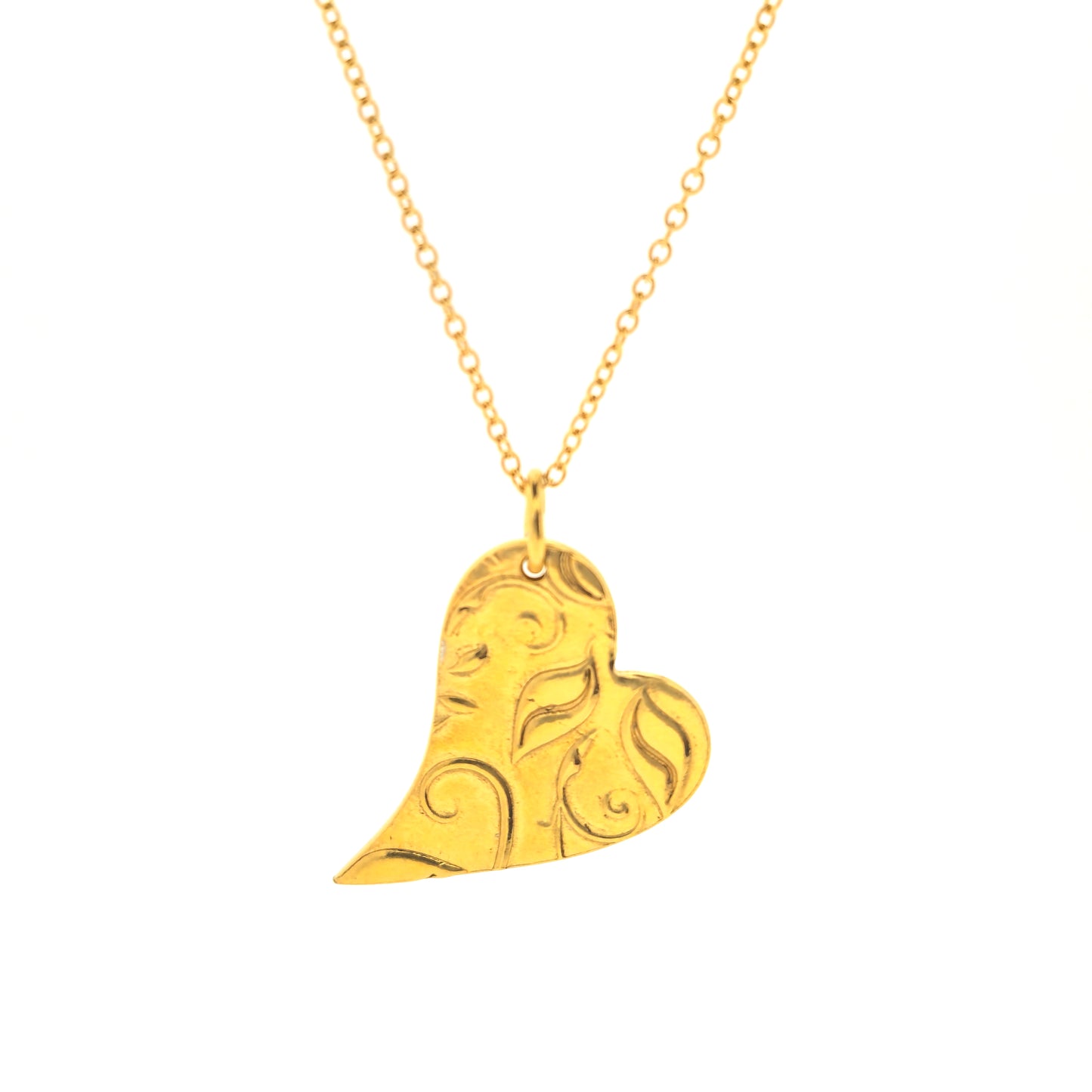 Yellow gold vermeil asymmetrical heart pendant with a leaf & vine design on a yellow gold vermeil chain.