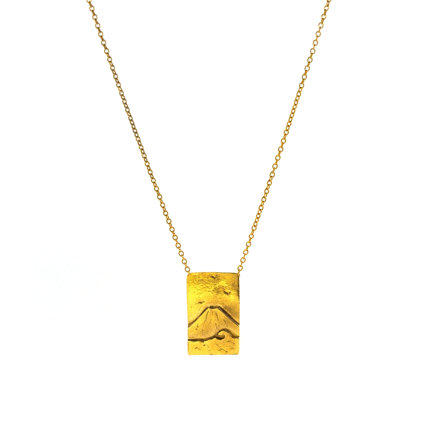 A rectangular yellow gold vermeil pendant featuring a mountain and sea scene. The pendant has an invisible bail and is on a yellow gold vermeil chain.