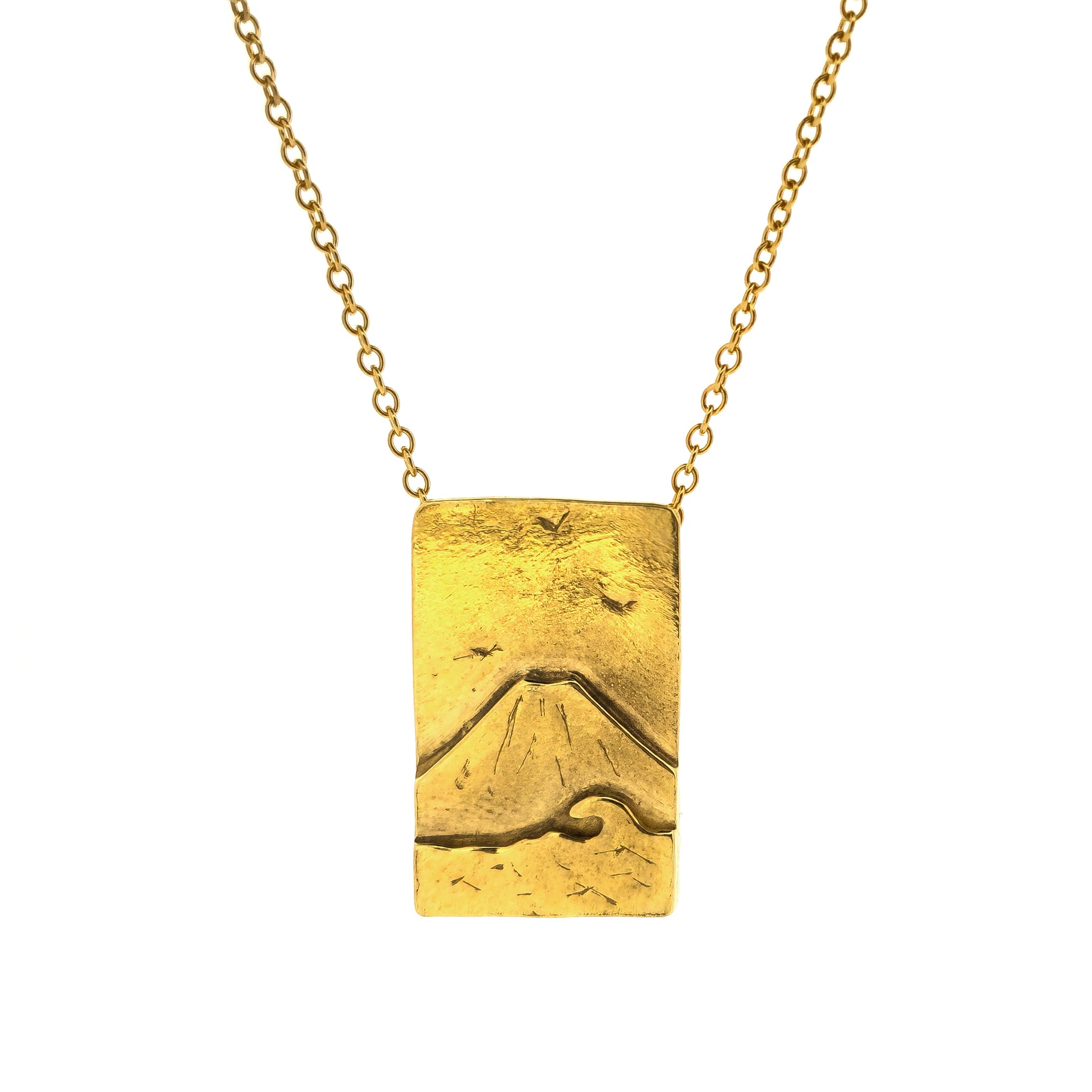 A rectangular yellow gold vermeil pendant featuring a mountain and sea scene. The pendant has an invisible bail and is on a yellow gold vermeil chain.